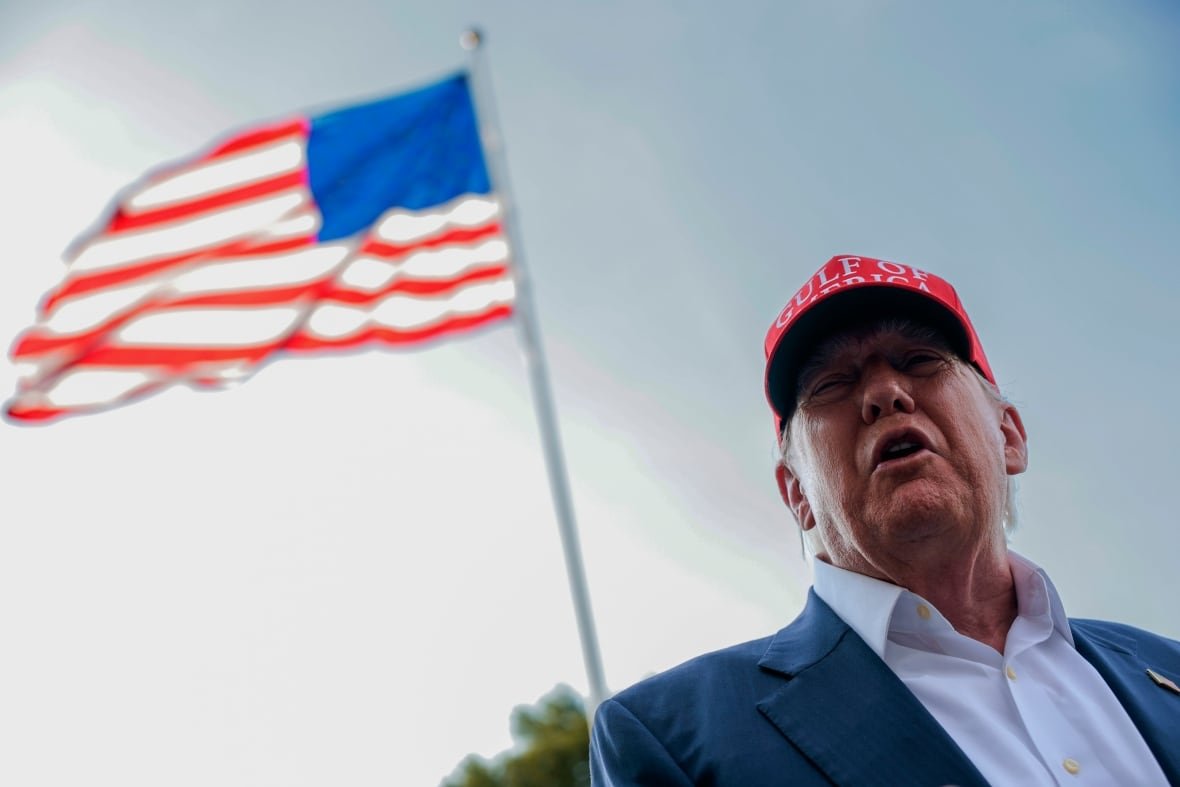 U.S. President Donald Trump speaks to reporters (not seen in photo) on the South Lawn of the White House.
