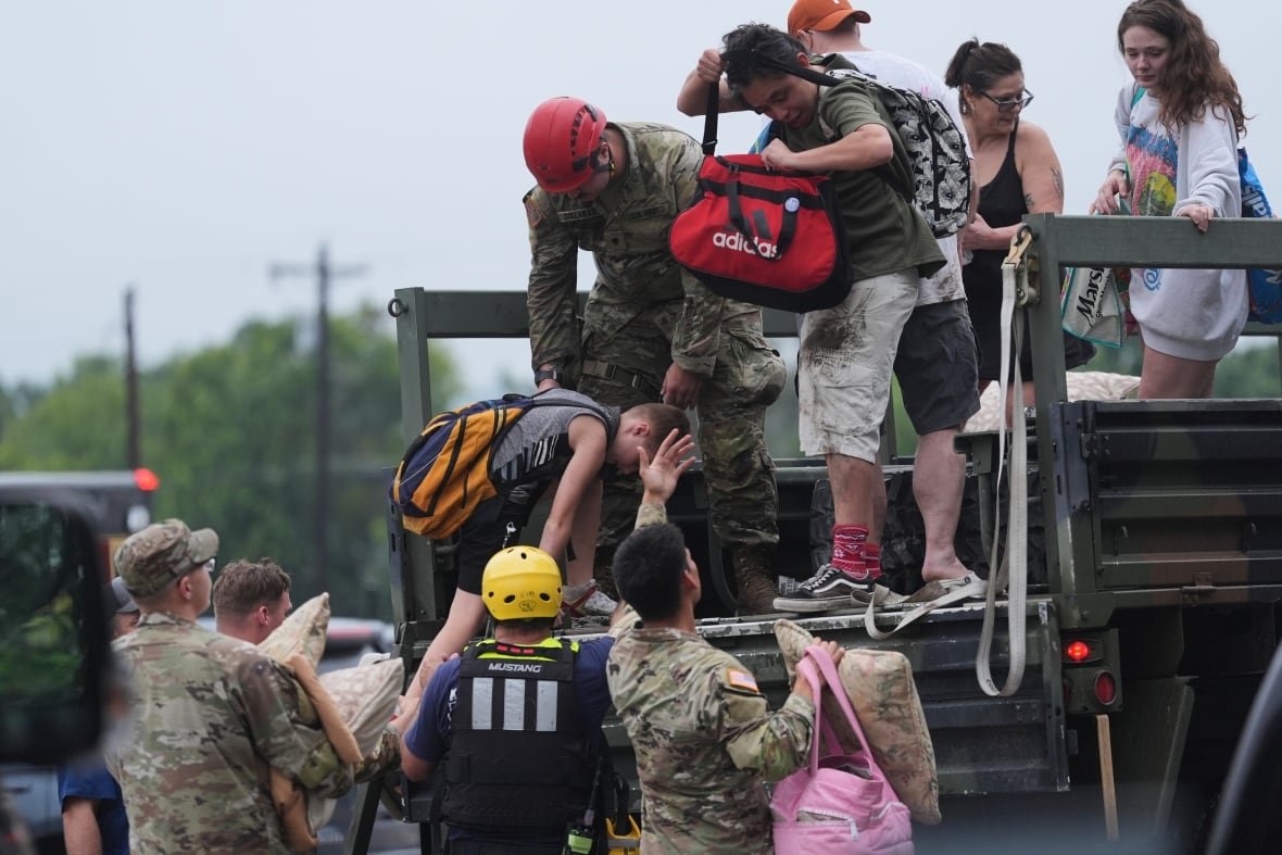 First responders deliver people to a reunification centre.