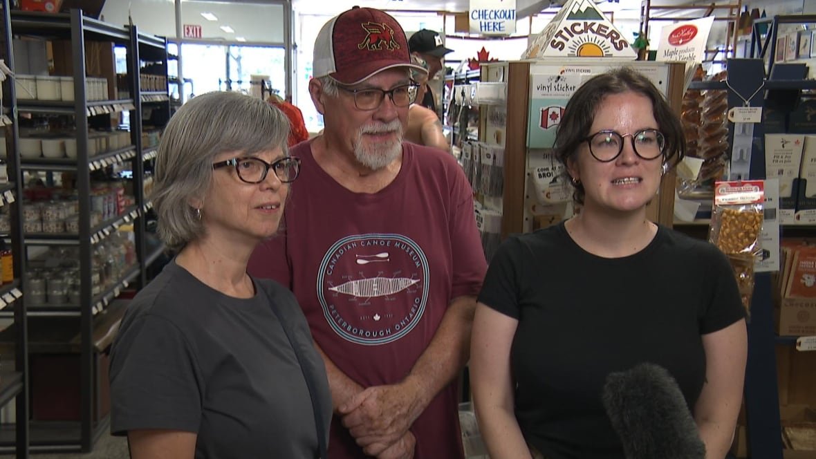Emily and her parents, Diane and Don, standing in the store, Maker House.