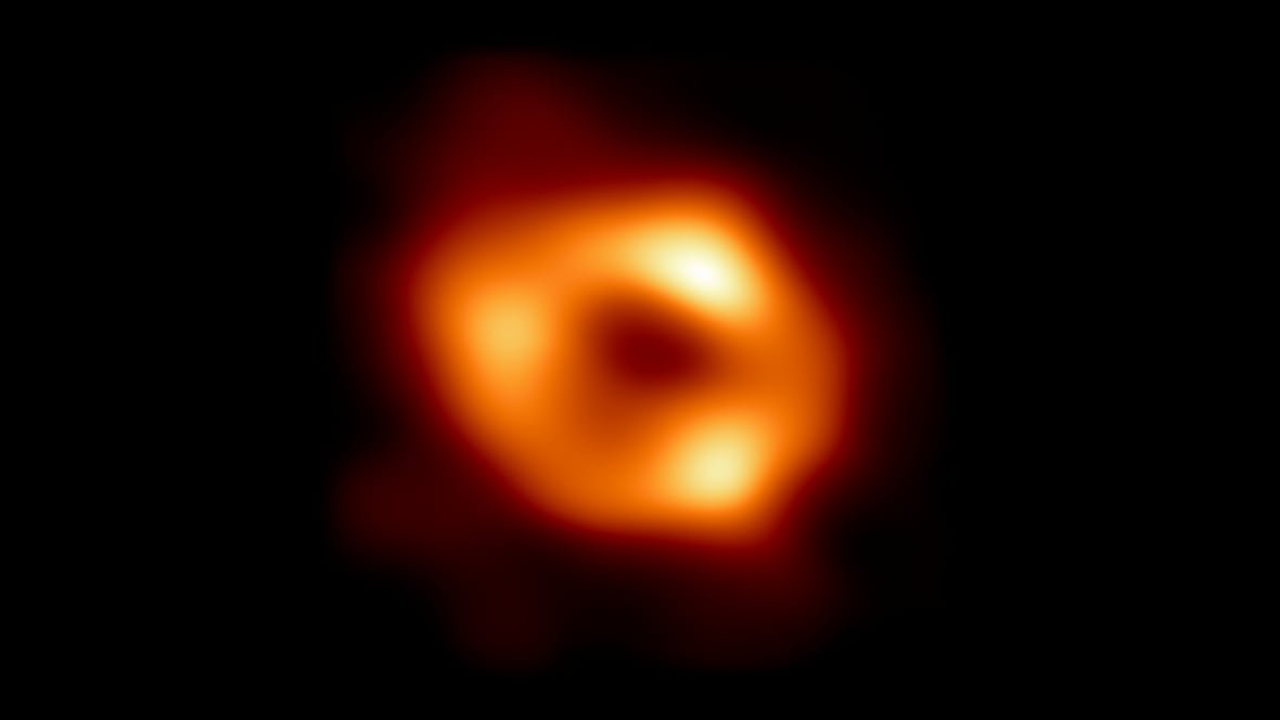 An orange ring with three bright areas capture the black hole at the centre of our galaxy.