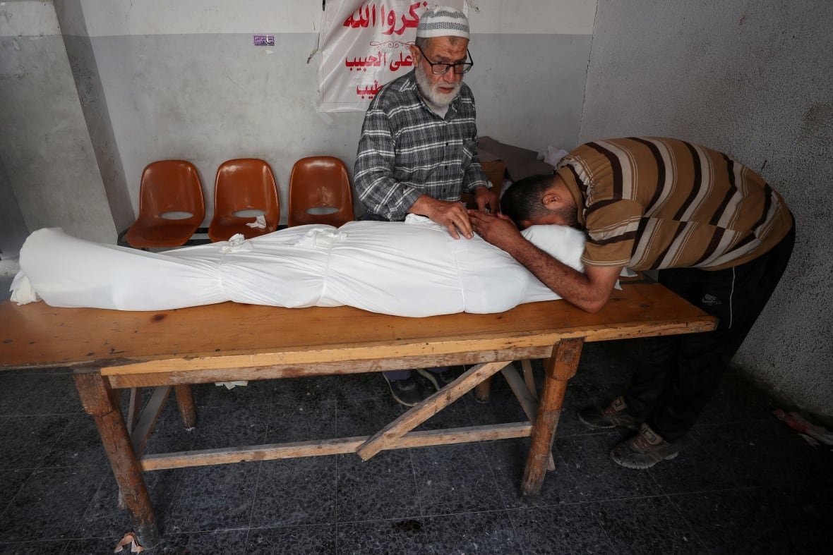 Mourners react during the funeral of Palestinians killed on Sunday.