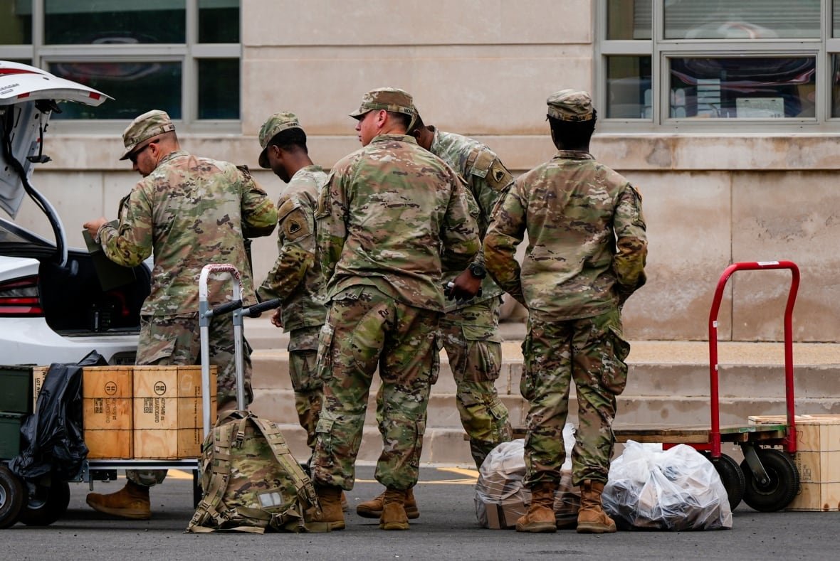 National Guard troops load supplies into a car truck in Washington, D.C.