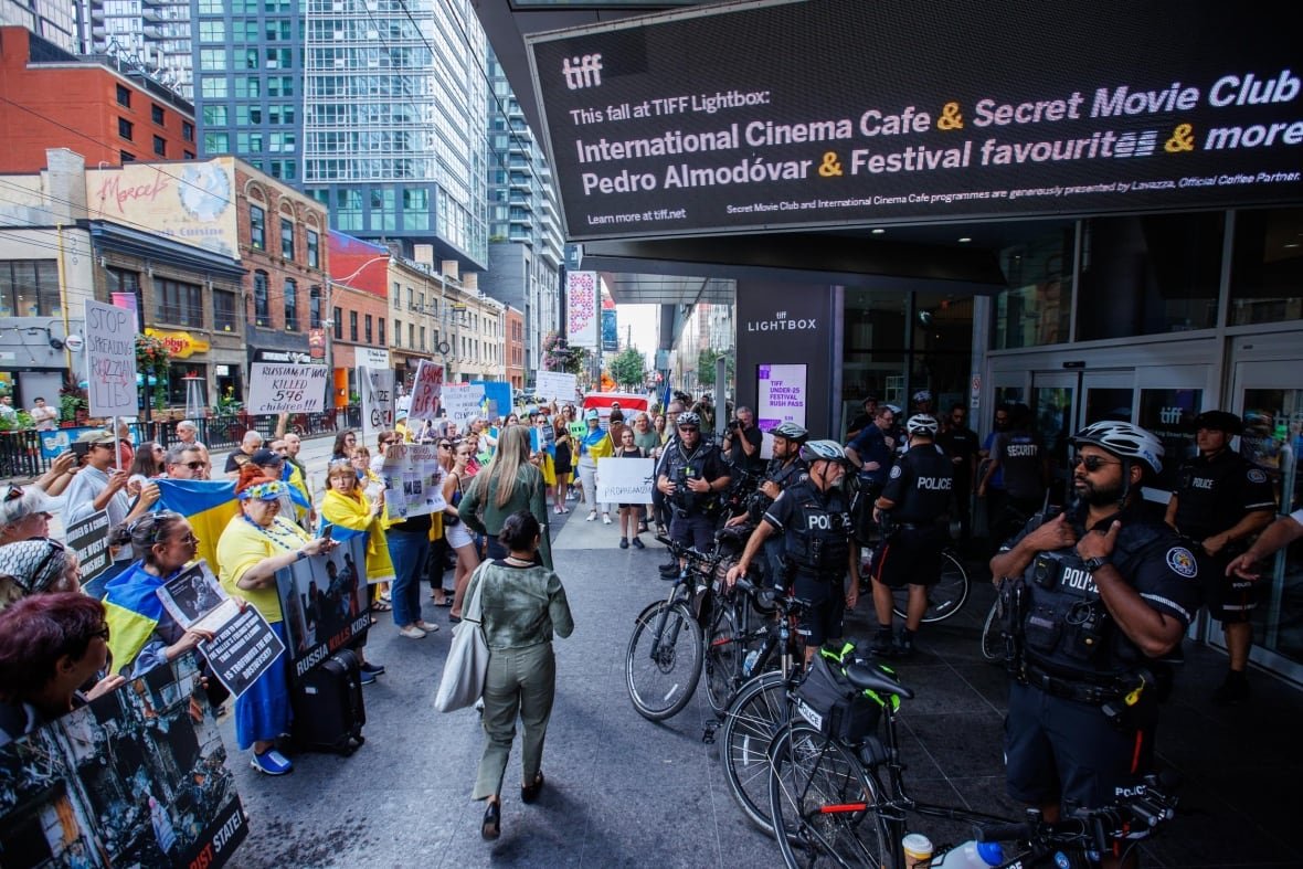 Protestors are photographed outside of the TIFF Lightbox theatre in Toronto during a screening of the documentary film Russians at War on Sept. 17, 2024. The documentary played at the Toronto International Film Festival (TIFF) Lightbox on Tuesday, after the festival suspended showings earlier this week due to security concerns. The documentary spurred protests from Ukrainian officials and community groups who say the film amounts to propaganda.