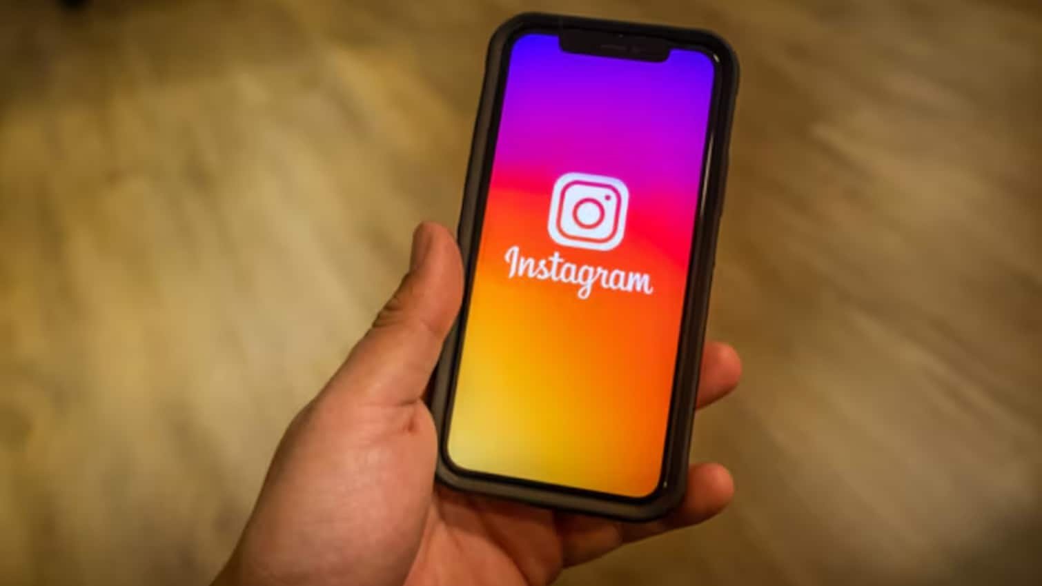 A person opens instagram on their phone. 