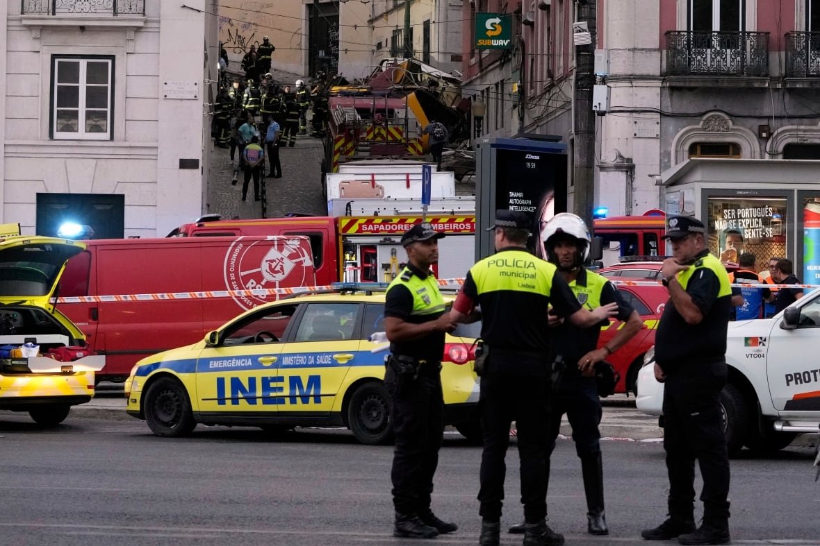 Emergency teams are seen at the site of a crash involving a funicular in Lisbon, Portugal.