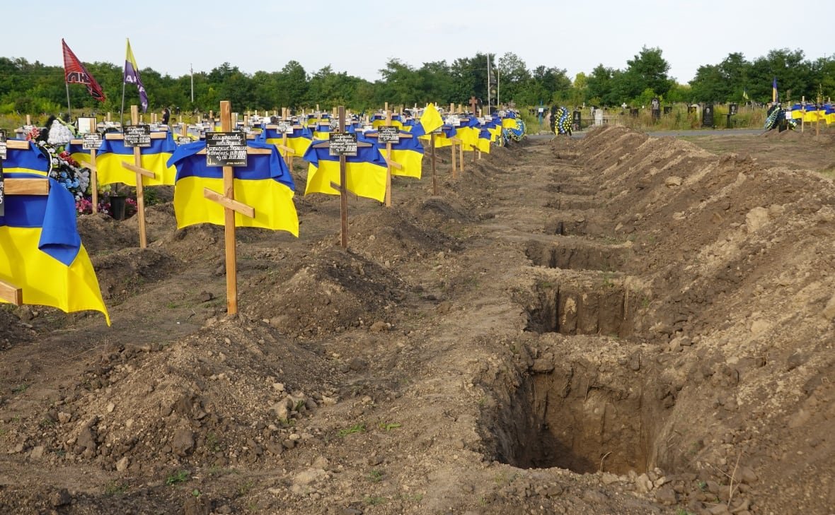 Simple wooden crosses mark the graves of unidentified soldiers in the eastern Ukrainian city of Dnipro.