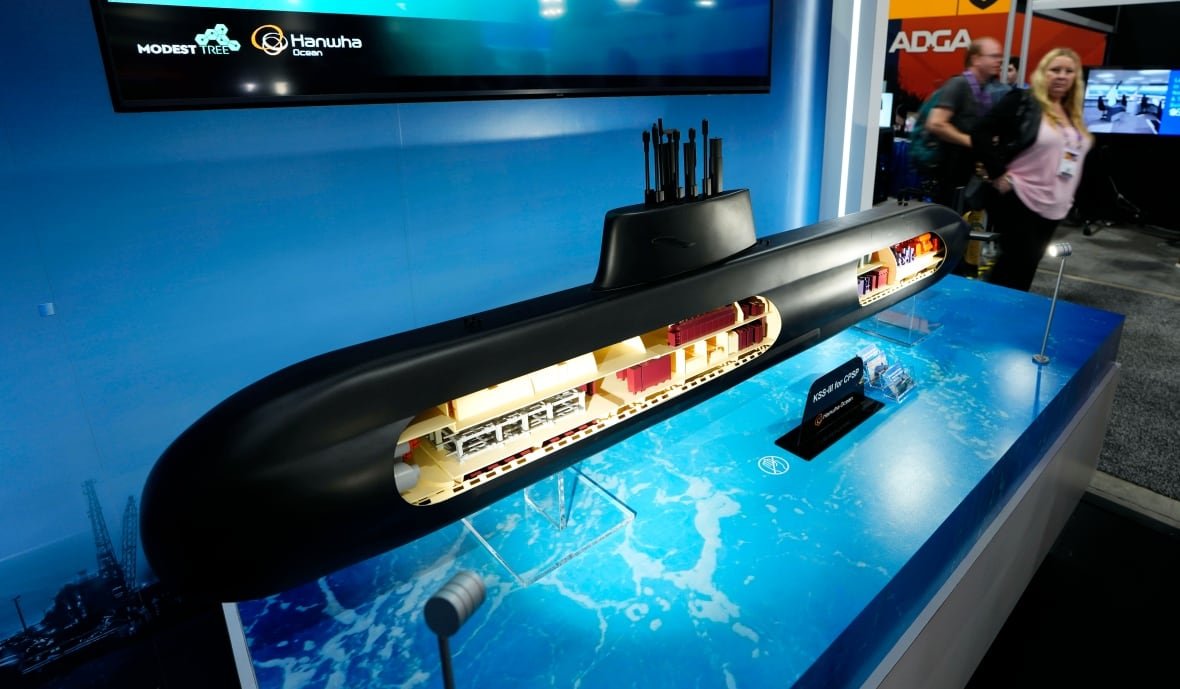 A model submarine is seen in a convention hall.