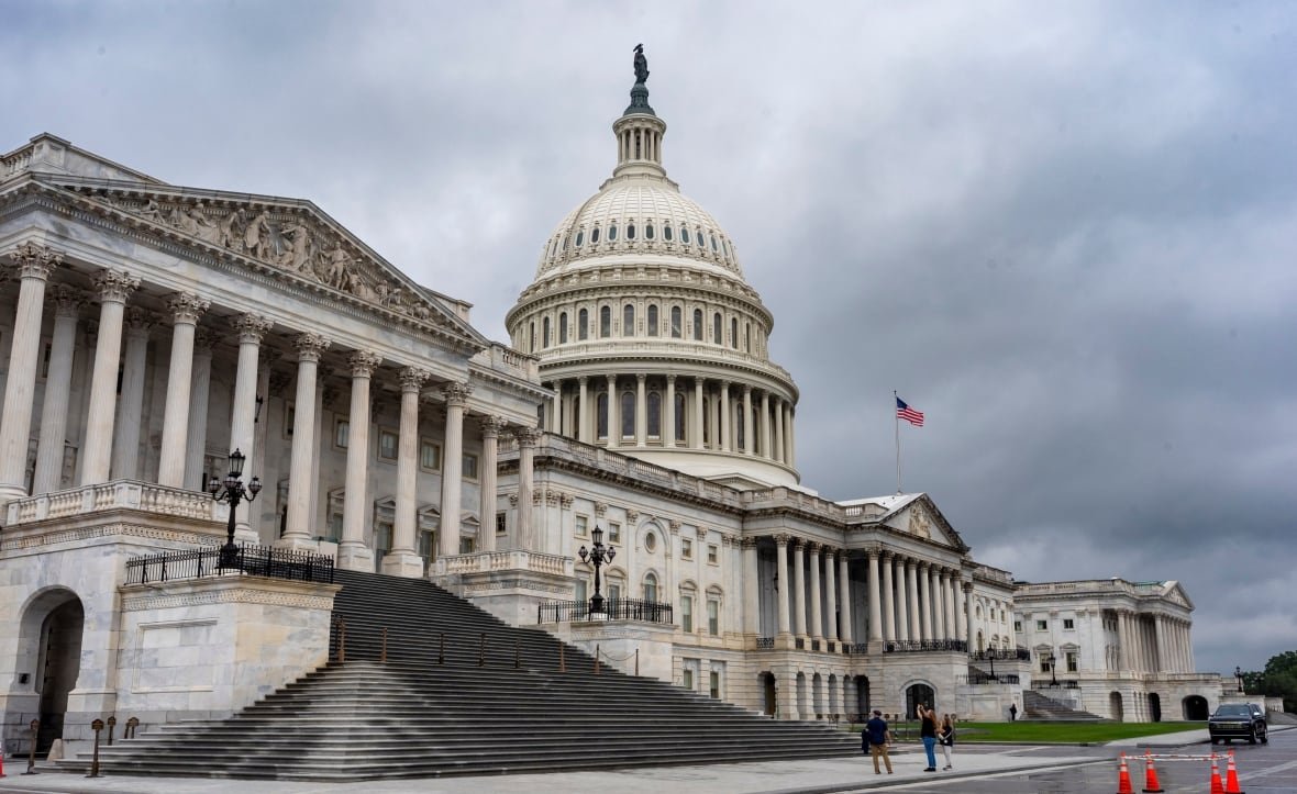 An exterior view of the U.S. Capitol during rainy weather.