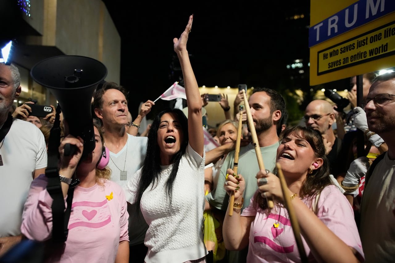 Group of people stand together celebrating