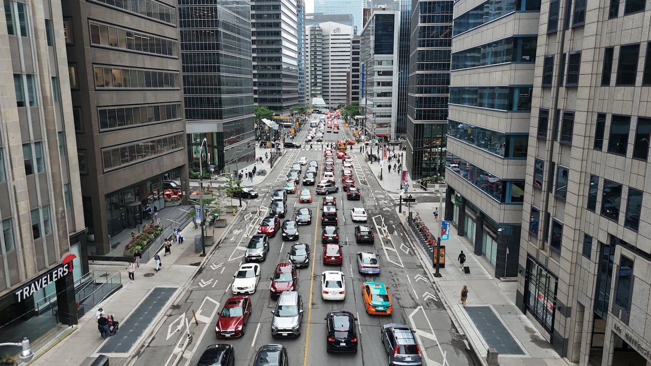 An aerial shot of a traffic jam on a busy downtown Toronto street.
