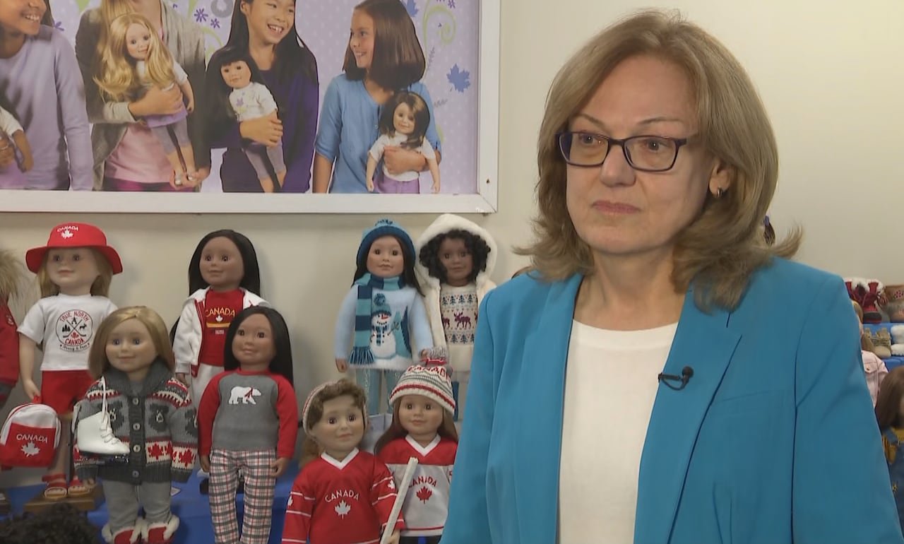 Kathryn Gallagher Morton posing with her dolls