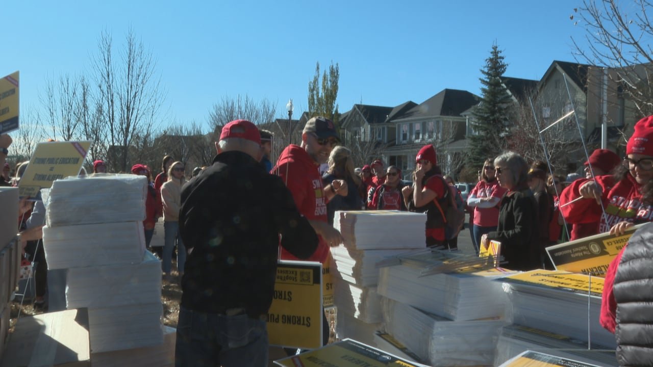 Protestors picking up signs.